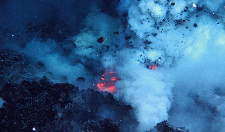 An undersea volcano erupting