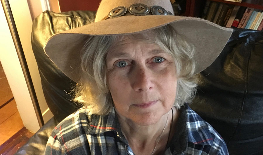 The author's wife, Carol, close-up, wearing a wide-brimmed sun hat. 