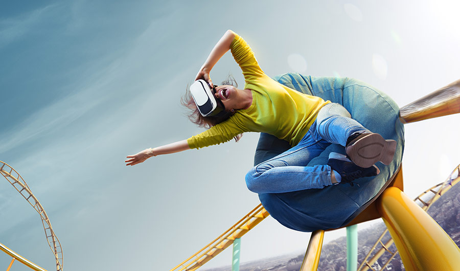 illustration of a person wearing a VR headset and sitting on a beanbag, but the beanbag is going along a roller coaster track